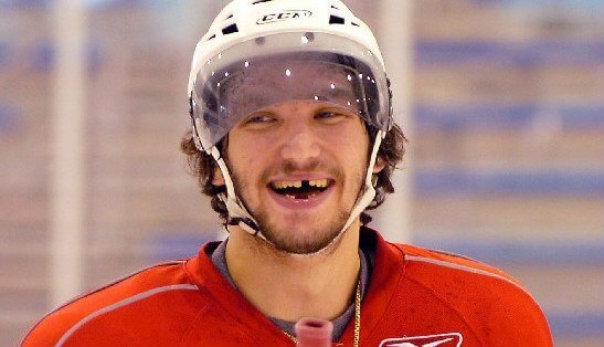 A hockey player that lost a tooth while playing